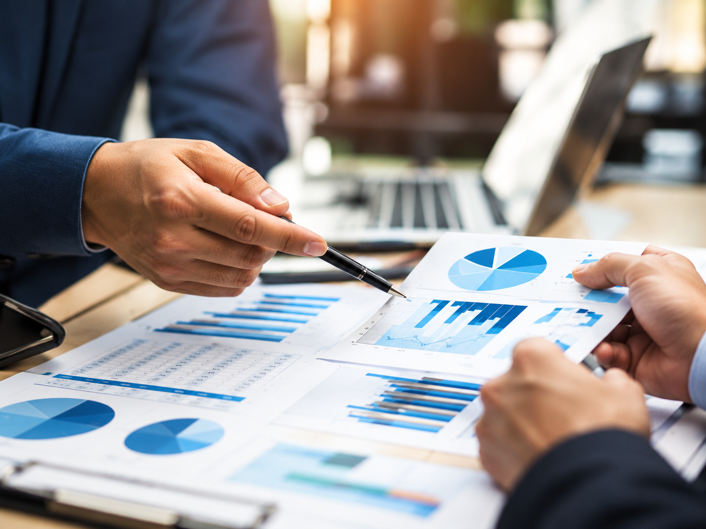 Accountants reviewing financial reports with a business client